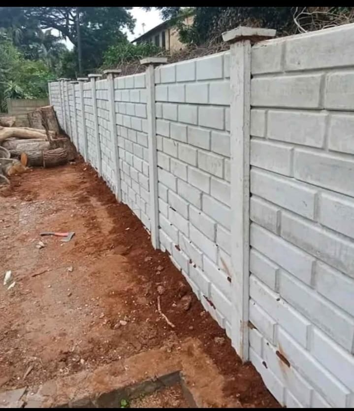 Finished brick-pattern precast boundary wall on a residential/commercial property