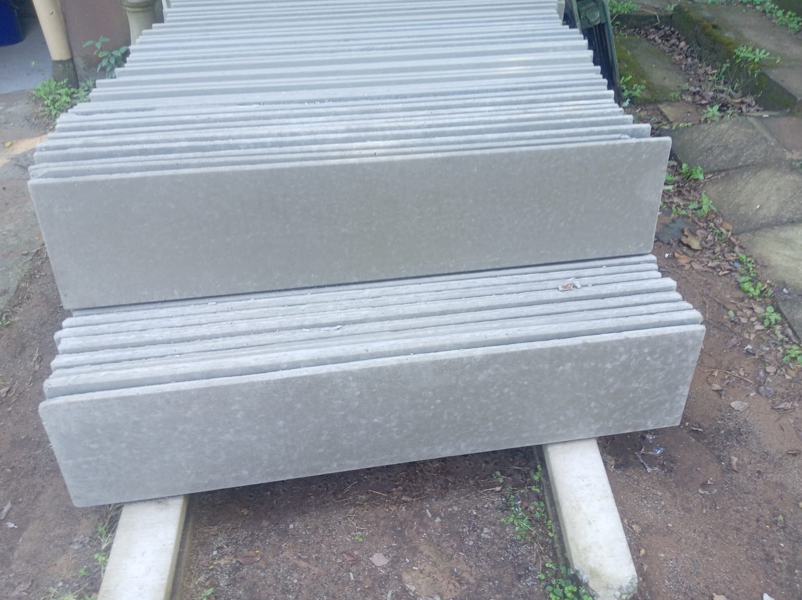 Grooved precast concrete panels stacked in the yard